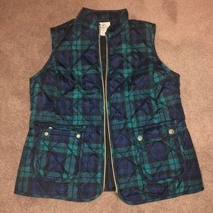 Green and blue puffer vest